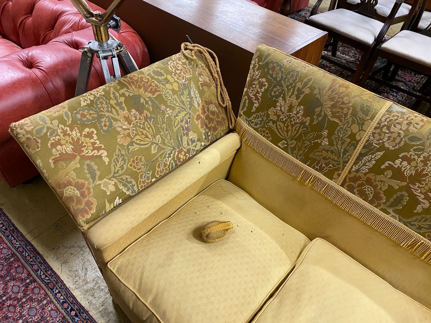 A Knole settee, upholstered in floral brocade, width 186cm, depth 80cm, height 104cm.